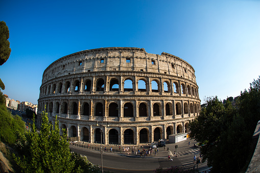 People are standing in front of the Colosseum in Rome in Italy in July 2015.