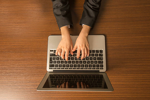 Finger pressing the shift key on the computer keyboard