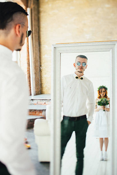 istock young couple look in the mirror 494219144