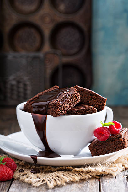 istock Brownies in stacked coffee cups with chocolate sauce 494220518