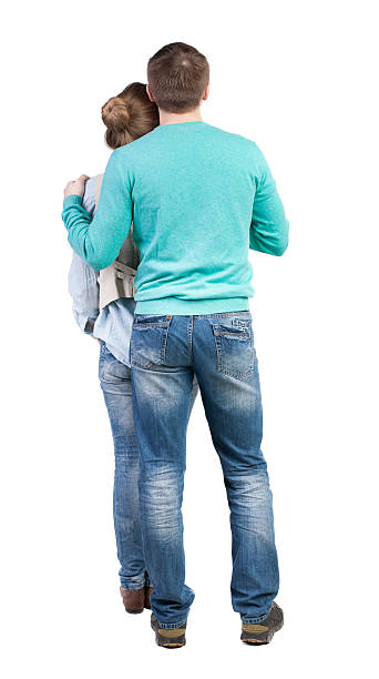 istock Back view of young embracing couple (man and woman) 494220900