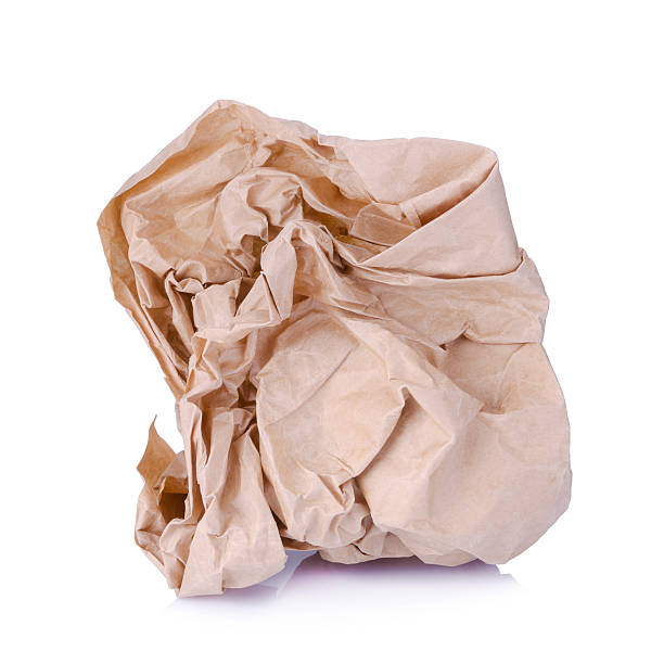 istock Crumpled brown paper balls isolated on white 494223260