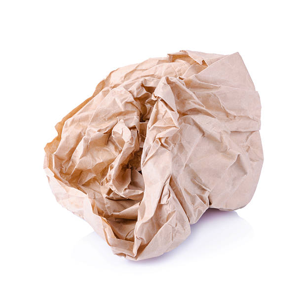 istock Crumpled brown paper balls isolated on white 494223568