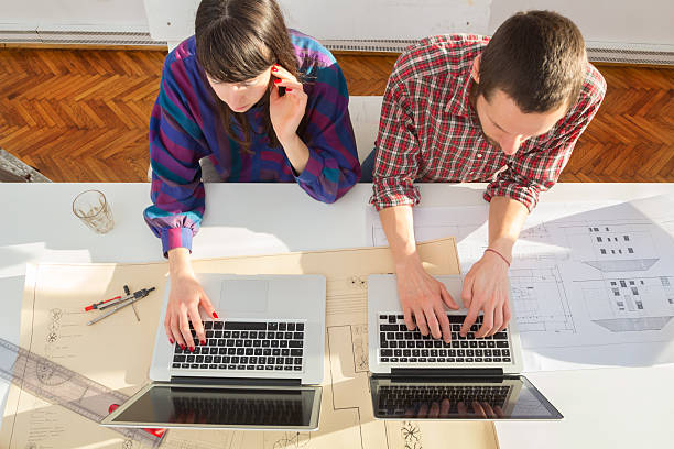 istock Young group of people/architects discussing business plans 494224900