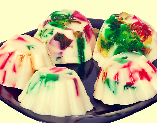 colorful milk fruit jelly puddings in shape of muffins