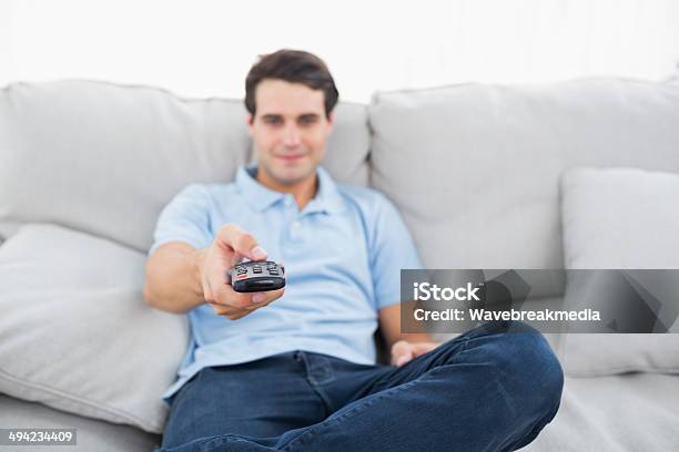 Man Changing Channel Stock Photo - Download Image Now - 20-24 Years, 20-29 Years, Adult