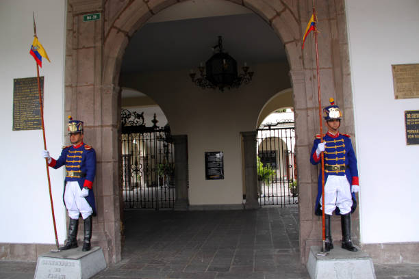 Quito, Ecuador - August 24, 2010: Honour guards flank the main entrance to the Carondelet Palace (Palacio de Carondelet), the seat of government of the Republic of Ecuador, located in Quito. Facing Independence Square or Plaza Grande, this historic building dates back to the 16th Century.