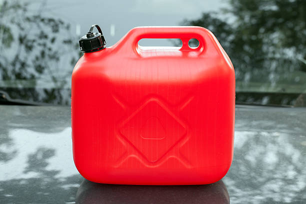 istock New red plastic jerrycan stands on car hood 494242630