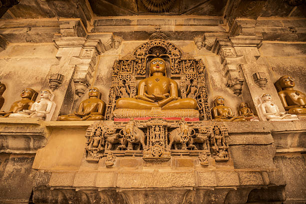 Mahaviras statues in the Jain temples complex in Jaisalmer Rajasthan India.  These are built in the Dilwara style and are dedicated to Rikhabdevji and Shambhavdev Ji, the Jain hermits known as 'Tirthankars'. All of them have beautiful crafted carvings of yellow sandstones.Build from the 12th to the 15th century, this religious buildings are located within the Jaisalmer Fort.