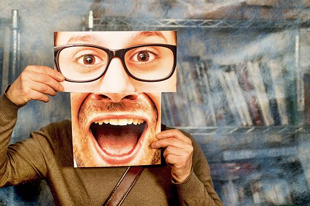 Man with Eyes and Mouth Photos in front His Face