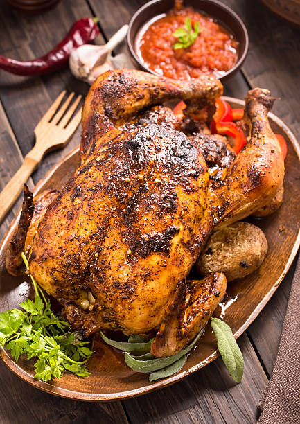 istock Grilled chicken with vegetables on wooden plate 494245496