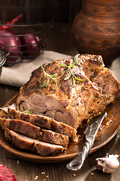 istock Sliced roasted pork and knife 494245932