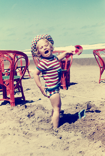 Vintage image of blond child at the beach