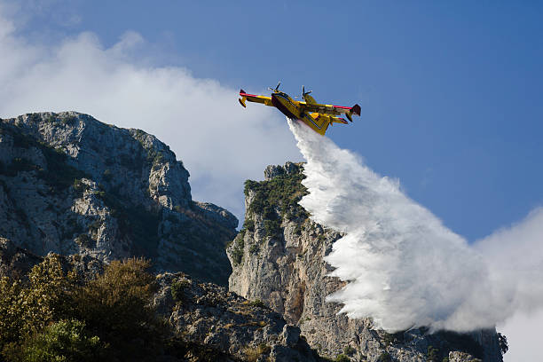 istock Yellow fire fighter aircraft drops all the water 494246412