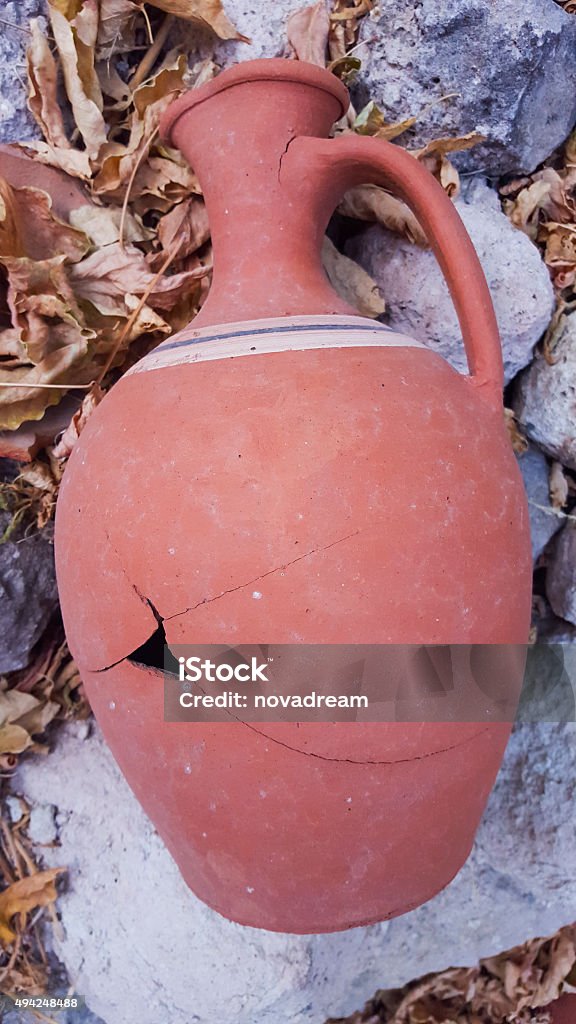 Broken Pitcher A broken pitcher on rocks 2015 Stock Photo