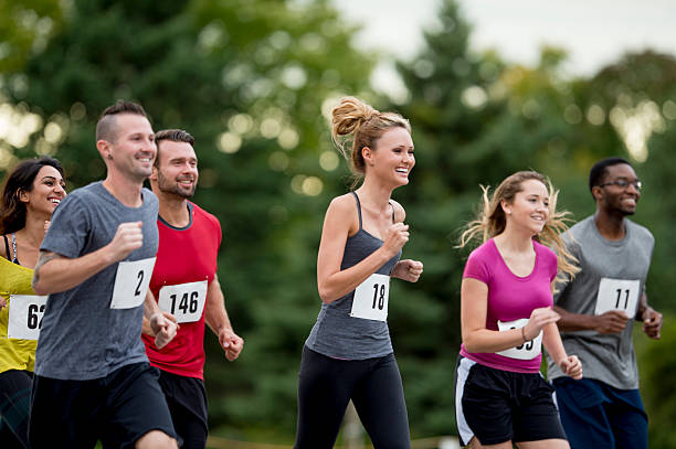 istock Athletes Jogging in a Race Together 494250912