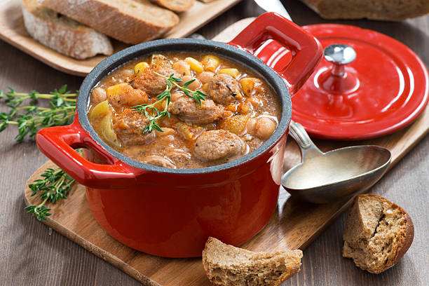 istock delicious vegetable stew with sausages in a pan 494251228