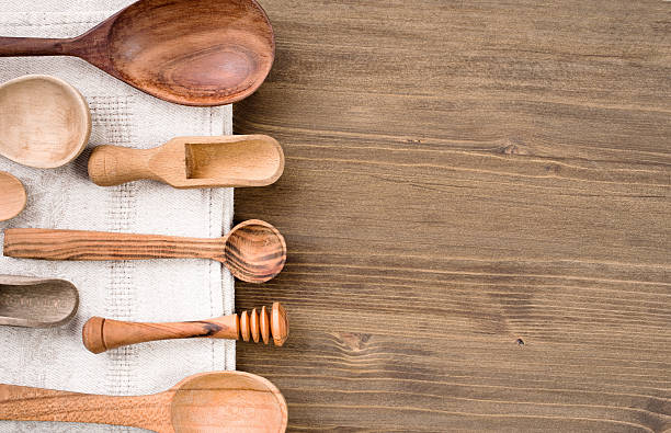 istock Various wooden spoons at left side of wooden table background 494251246
