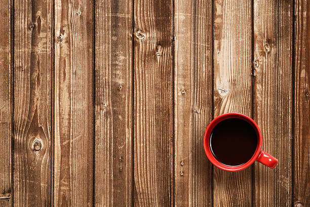 istock Coffee cup top view on wooden table 494251516