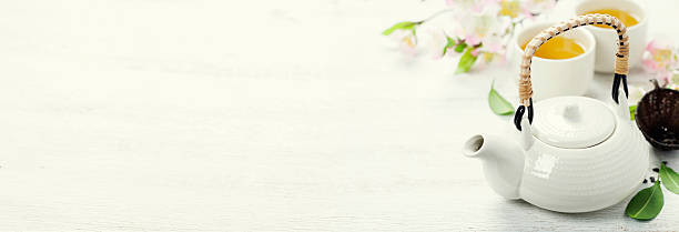 istock Chinese Tea Set and pink sakura blossom 494254620