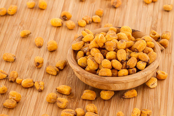 istock Homemade Salty Corn Nuts in a Bowl on Bamboo background 494254720