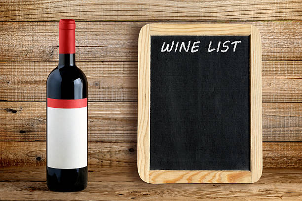 istock Wine bottle and blackboard for wine list 494256736