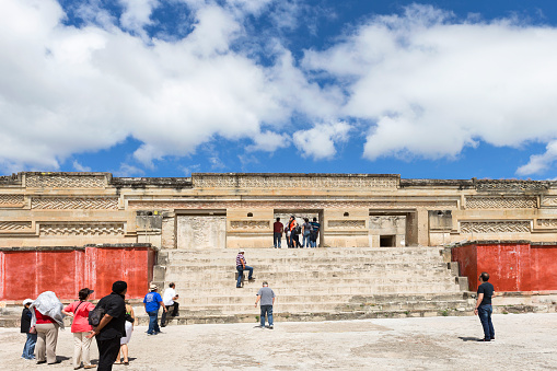 Mitla, Mexico - October 15, 2015: Tourists visit The Palace of Columns at Mitla archaeological site, Oaxaca state, Mexico