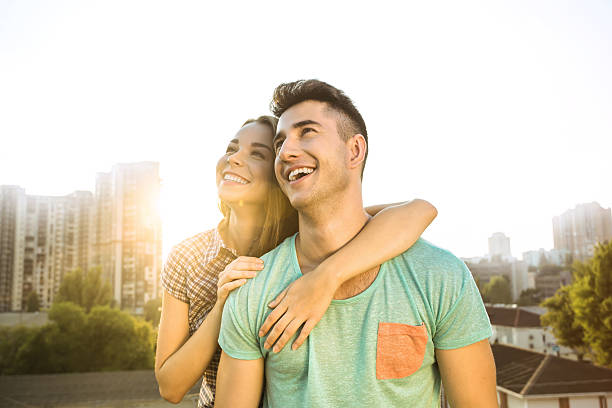 Girl and boy are outdoors at roof