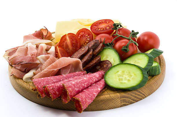 istock Cold meals and vegetables on wood plate 494259523