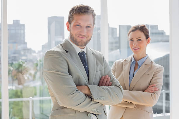 istock Smiling business partners with arms crossed 494260019