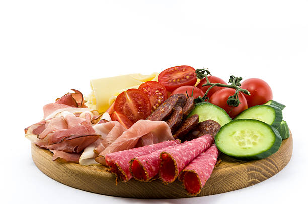 istock Cold meals and vegetables on wood plate 494260127