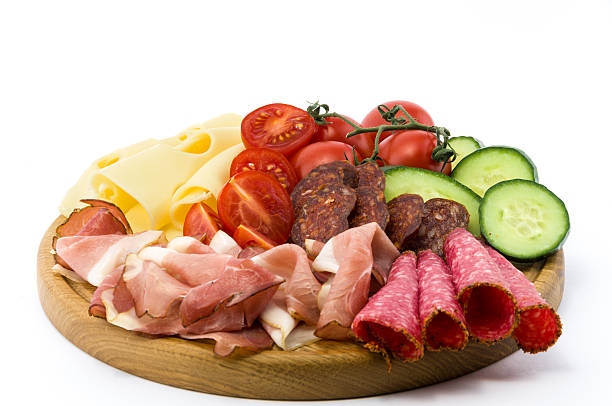 istock Cold meals and vegetables on wood plate 494260129