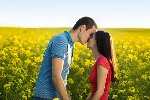 istock Couple in love in field 494262019