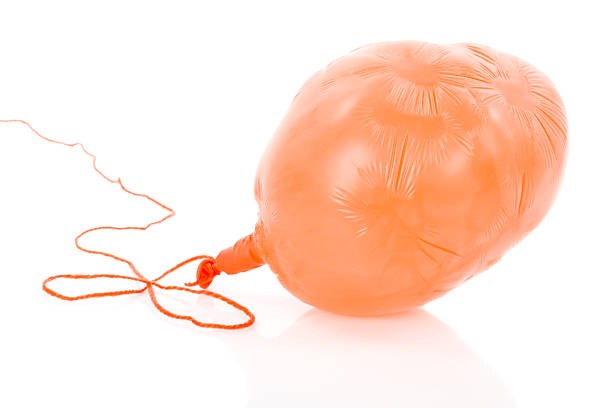Deflated Orange Balloon Isolated Over White Stock Photo - Download Image  Now - Balloon, Deflated, Deflating - iStock