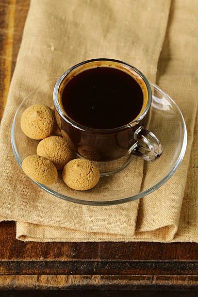 istock cup of black coffee with biscuits amaretti (almond cookies) 494262199
