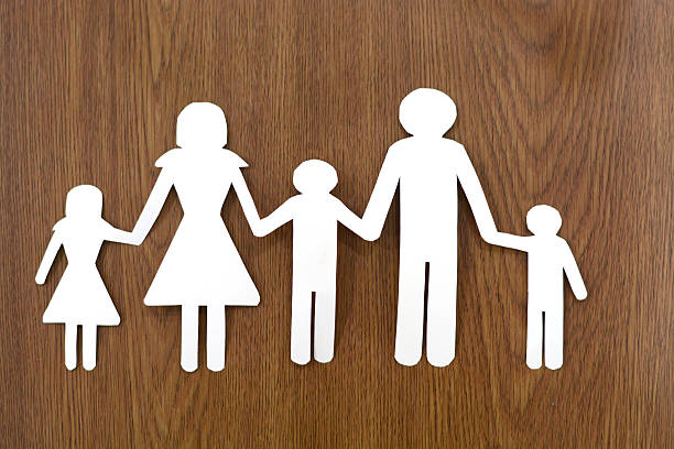 istock Family from paper on grass 494263531