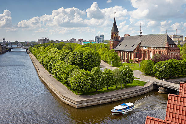 Kant island in Kaliningrad, Russia View of the island of Kant and the Cathedral with Beacon Fishing Village kaliningrad stock pictures, royalty-free photos & images