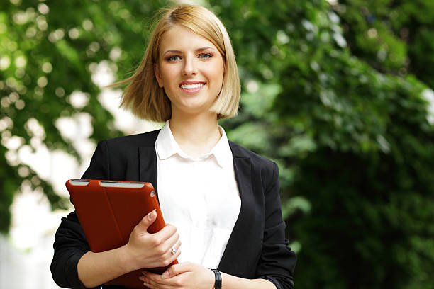 istock young smiling woman in park 494264277