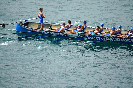 San Sebastian, Spain - September 9, 2012: Rowing team in action. in San Sebastian Spain. People appearing belong to a local team who are training at the bay of San Sebastian, Spain.