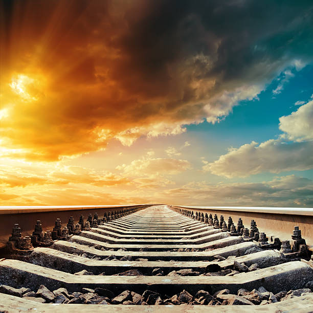 istock railway to horizon under sunset 494277847