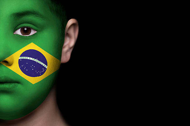 istock Human face painted with flag of Brasil 494279241