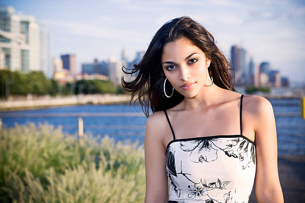 istock Cute Girl Standing in a Park During Sunset 494279526