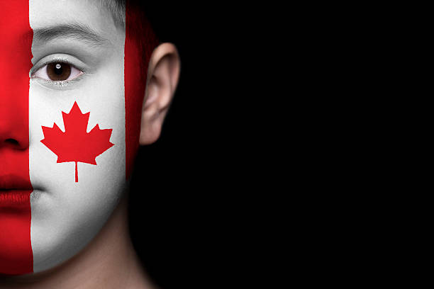 istock Human face painted with flag of Canada 494279971