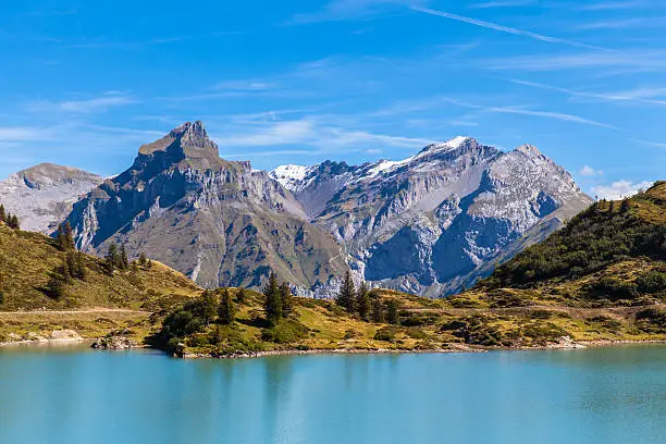 Stunning view of Truebsee (lake) with the peak Hahnen and Wissberg of alps in background, canton of Nidwalden, central Switerland.