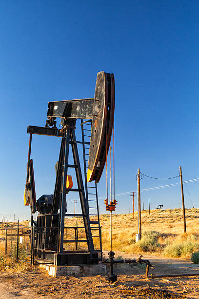 istock Working oil pump in desert 494280326