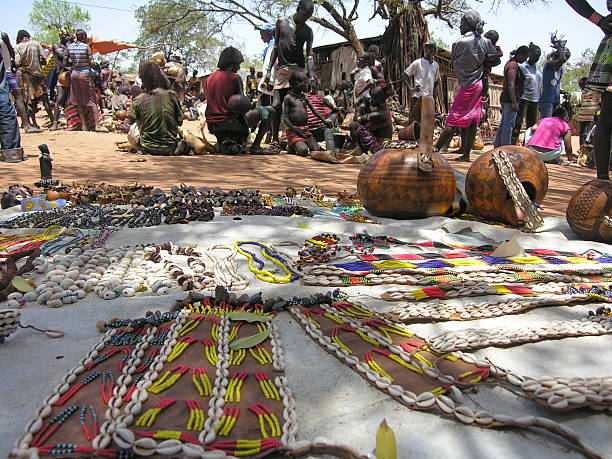 Traditional Hamer market in Dimeka, Valley Omo, Ethiopia. Valley Omo, Ethiopia - March 13th, 2012: Traditional Hamer market in Dimeka, Valley Omo, Ethiopia. hamer tribe photos stock pictures, royalty-free photos & images