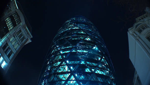 Top of The Gherkin building at night Long exposure of the top of The Gherkin building on St Mary's Axe at night. london gherkin at night stock pictures, royalty-free photos & images
