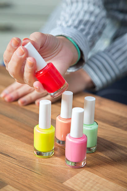 istock Unrecognizable woman holding red nail polish. 494283762