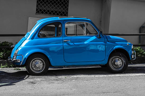 Sartene, France - August 19, 2018: Blue Fiat 500 compact car stands parked on a roadside