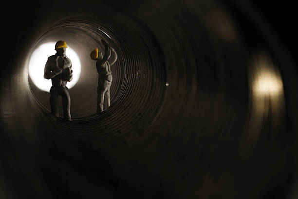 mini train sewer tunnel workers stock photo